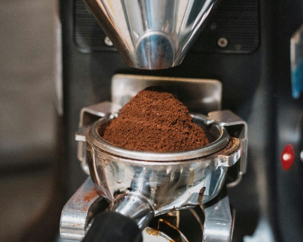 Close-Up of Espresso Machine Grinding Coffee Beans