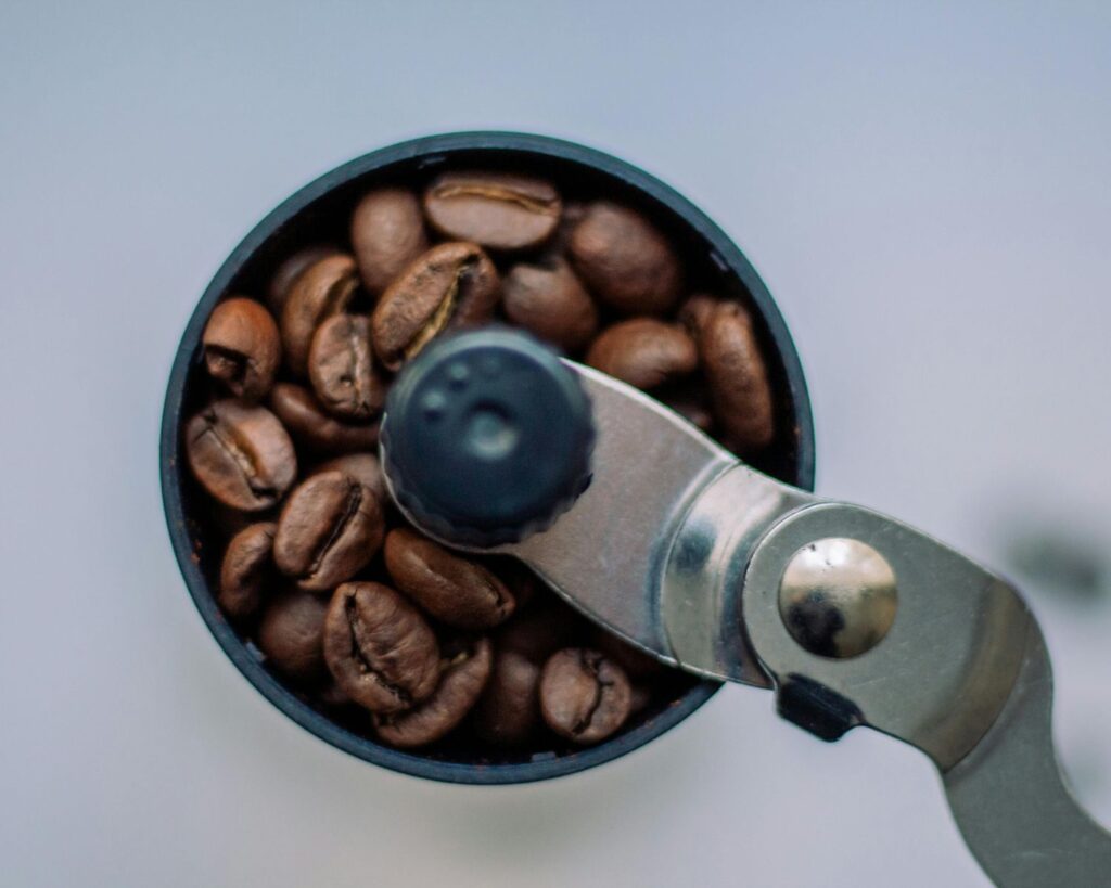 Top view of coffee beans in a grinder