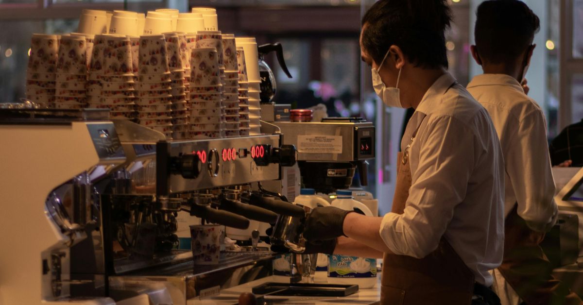 Barista making Coffee with an Espresso Machine