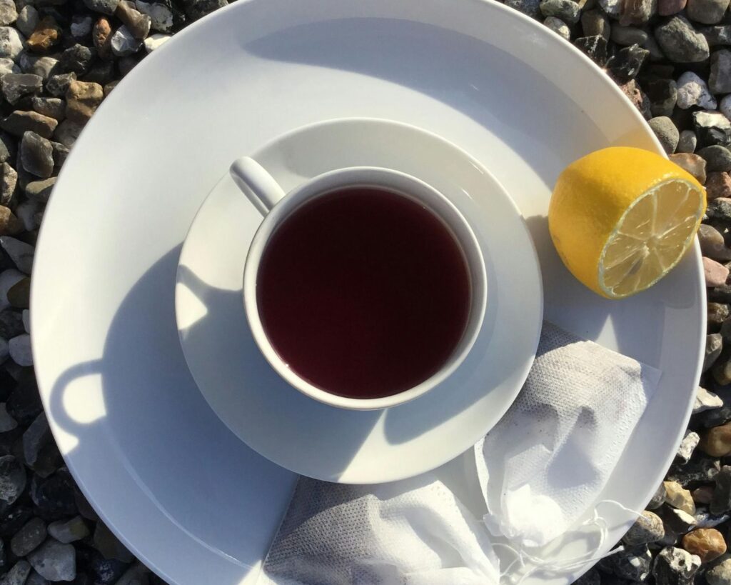 Coffee on a cup with sliced lemon