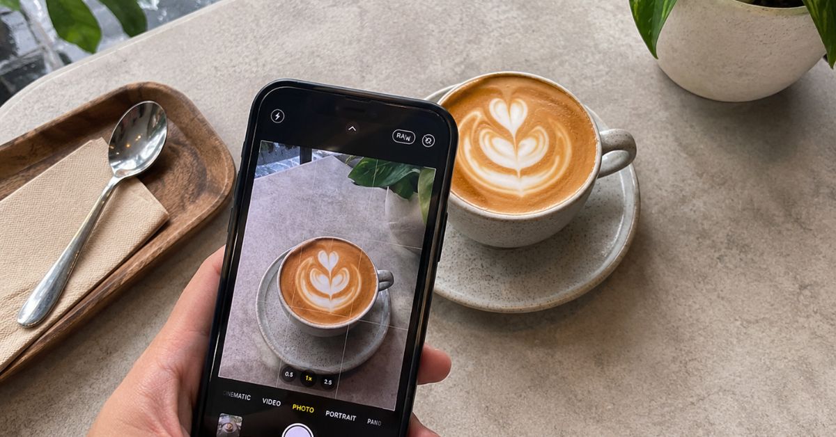 Taking a Photo of Coffee in a Coffee Shop